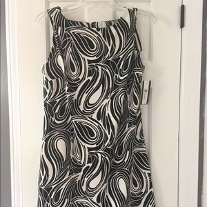 Knee length sleeveless dress.